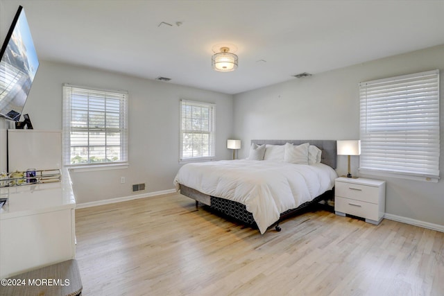 12 Harbor Ct, West Long Branch, NJ 07764 - bedroom with light wood-style floors and baseboards