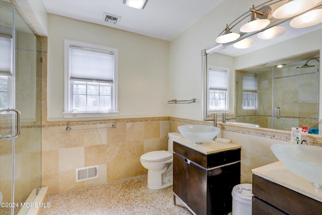 12 Harbor Ct, West Long Branch, NJ 07764 - full bathroom with tile walls, a shower stall, vanity, and a wainscoted wall