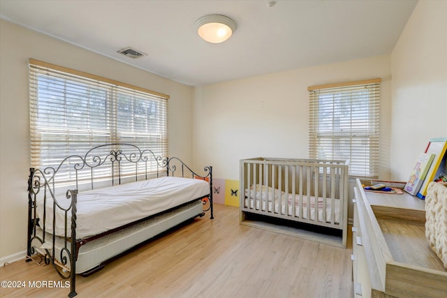 12 Harbor Ct, West Long Branch, NJ 07764 - bedroom with multiple windows and wood finished floors