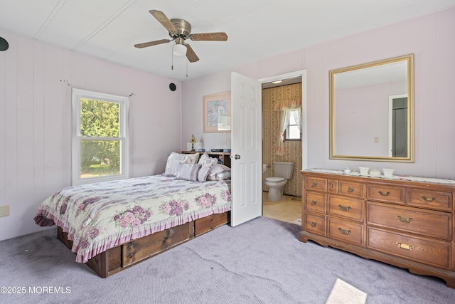 124 Village Rd, Morganville, NJ 07751 - bedroom with multiple windows, carpet, ensuite bathroom, and ceiling fan