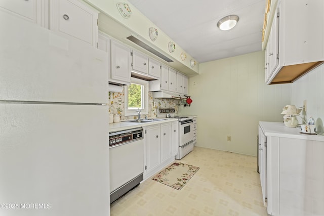 124 Village Rd, Morganville, NJ 07751 - kitchen featuring white appliances, light countertops, light flooring, white cabinetry, and under cabinet range hood