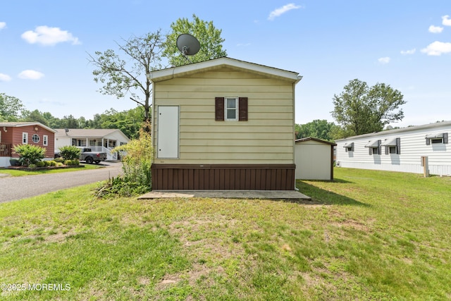 124 Village Rd, Morganville, NJ 07751 - view of side of property with a yard