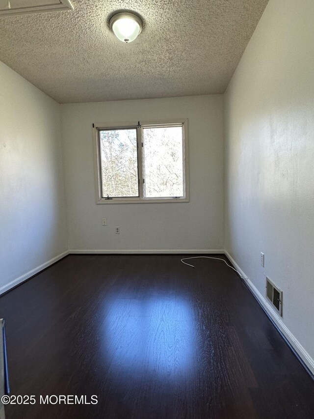115 Brandywine Ct Unit 115, Brick, NJ 08724 - spare room featuring wood finished floors and a textured ceiling