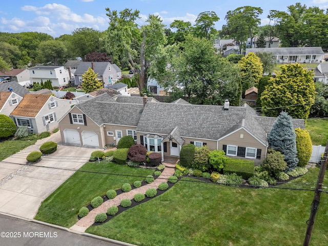 149 9th St, Belford, NJ 07718 - view of front facade featuring concrete driveway, a residential view, a front yard, and an attached garage