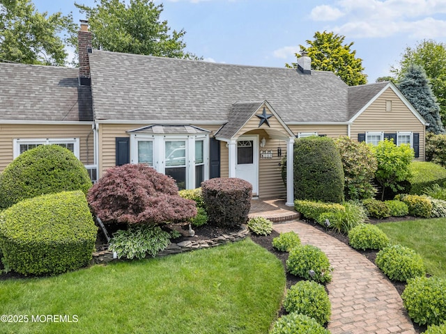 149 9th St, Belford, NJ 07718 - cape cod home featuring a chimney and a shingled roof