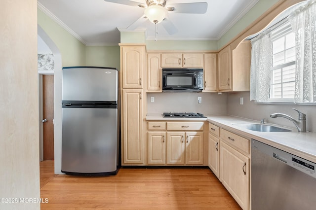 149 9th St, Belford, NJ 07718 - kitchen with stainless steel appliances, light brown cabinetry, light wood finished floors, a ceiling fan, and ornamental molding