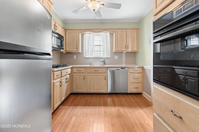 149 9th St, Belford, NJ 07718 - kitchen featuring black appliances, light brown cabinetry, ornamental molding, light wood-type flooring, and light countertops