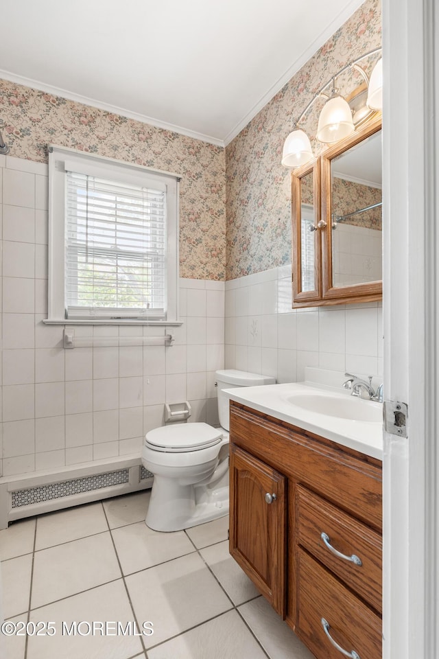149 9th St, Belford, NJ 07718 - bathroom featuring a baseboard radiator, vanity, ornamental molding, wallpapered walls, and tile patterned flooring