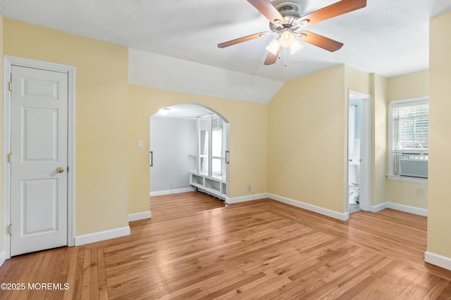 149 9th St, Belford, NJ 07718 - unfurnished room with arched walkways, light wood-style floors, cooling unit, ceiling fan, and vaulted ceiling