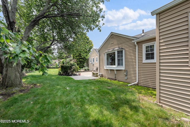 149 9th St, Belford, NJ 07718 - view of green lawn with a patio area