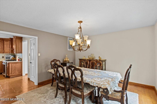 519 Gilford Ave, Toms River, NJ 08753 - dining space featuring a chandelier and light wood-type flooring