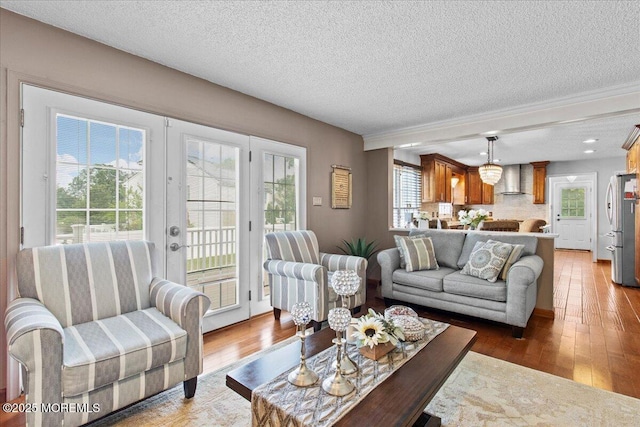 519 Gilford Ave, Toms River, NJ 08753 - living room featuring a textured ceiling, hardwood / wood-style flooring, and french doors