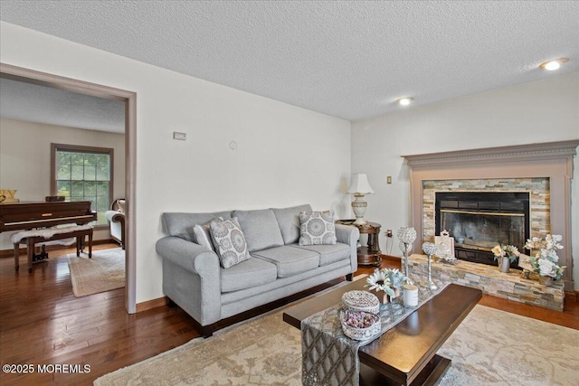 519 Gilford Ave, Toms River, NJ 08753 - living room with wood finished floors, a textured ceiling, and a fireplace