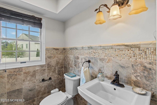519 Gilford Ave, Toms River, NJ 08753 - half bath with tile walls and a wainscoted wall