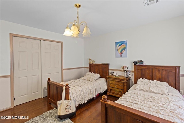 519 Gilford Ave, Toms River, NJ 08753 - bedroom with a chandelier, wood finished floors, and a closet