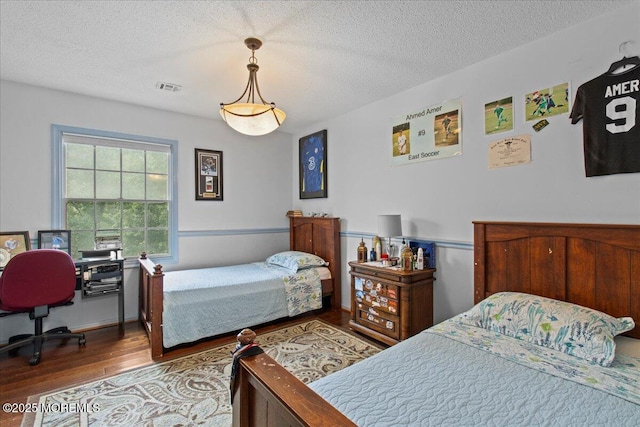 519 Gilford Ave, Toms River, NJ 08753 - bedroom featuring wood finished floors and a textured ceiling