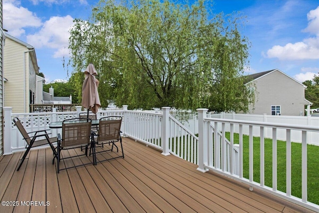 519 Gilford Ave, Toms River, NJ 08753 - wooden deck with outdoor dining space and a fenced backyard