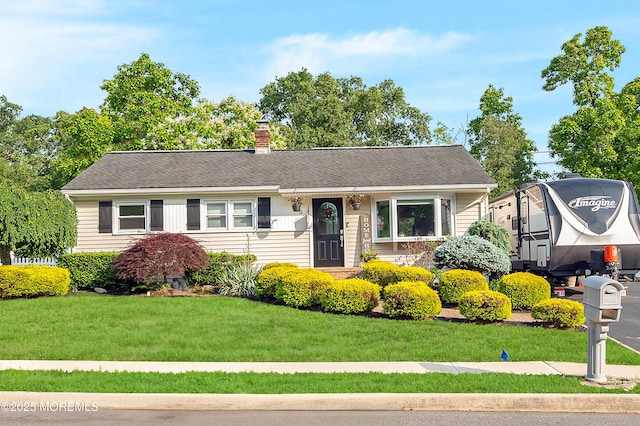 5 Robert Ave, Howell, NJ 07731 - view of front of home featuring a front yard and a chimney
