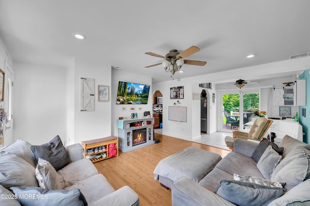 5 Robert Ave, Howell, NJ 07731 - living area with ceiling fan, recessed lighting, light wood-style floors, and a warm lit fireplace