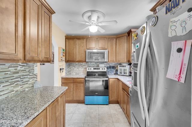 5 Robert Ave, Howell, NJ 07731 - kitchen with appliances with stainless steel finishes, backsplash, a ceiling fan, and light stone countertops