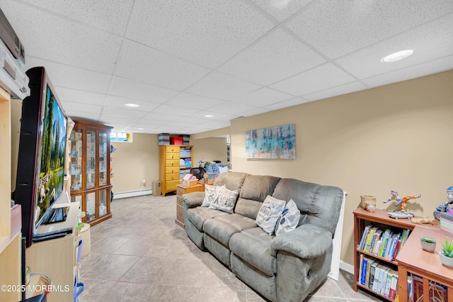5 Robert Ave, Howell, NJ 07731 - tiled living room with baseboard heating, a drop ceiling, and recessed lighting
