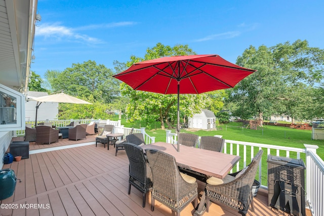 5 Robert Ave, Howell, NJ 07731 - wooden terrace with outdoor lounge area, outdoor dining area, a storage unit, and a lawn