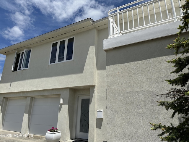 5205 Ocean Dr S, Brigantine City, NJ 08203 - view of home's exterior featuring stucco siding and a garage