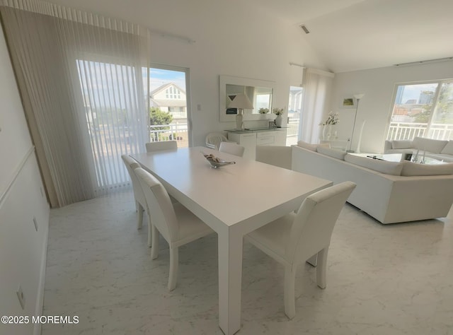 5205 Ocean Dr S, Brigantine City, NJ 08203 - dining space featuring healthy amount of natural light and vaulted ceiling