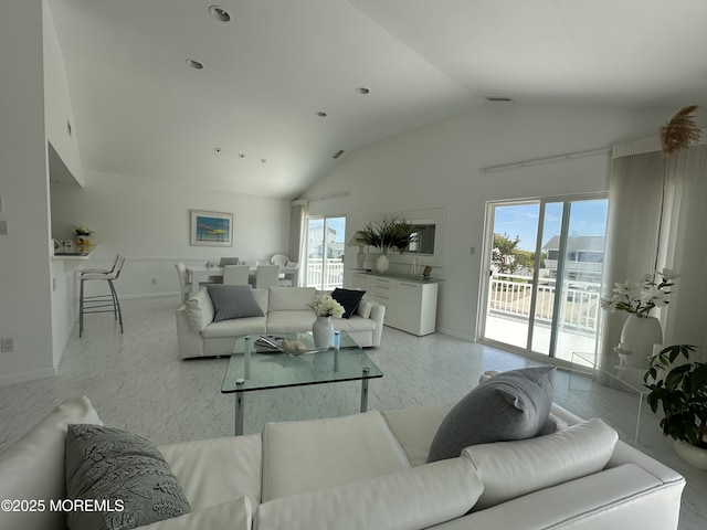 5205 Ocean Dr S, Brigantine City, NJ 08203 - living area featuring vaulted ceiling and baseboards