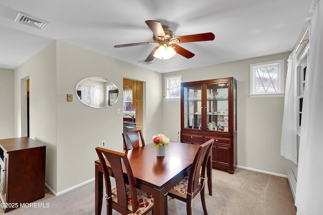 7 Robinson Rd, Brick, NJ 08724 - dining space featuring a ceiling fan, healthy amount of natural light, a baseboard heating unit, and light colored carpet