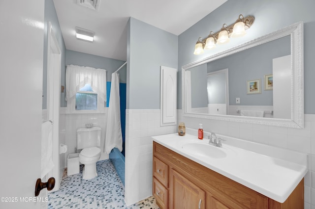 7 Robinson Rd, Brick, NJ 08724 - full bath featuring tile walls, vanity, a wainscoted wall, and curtained shower