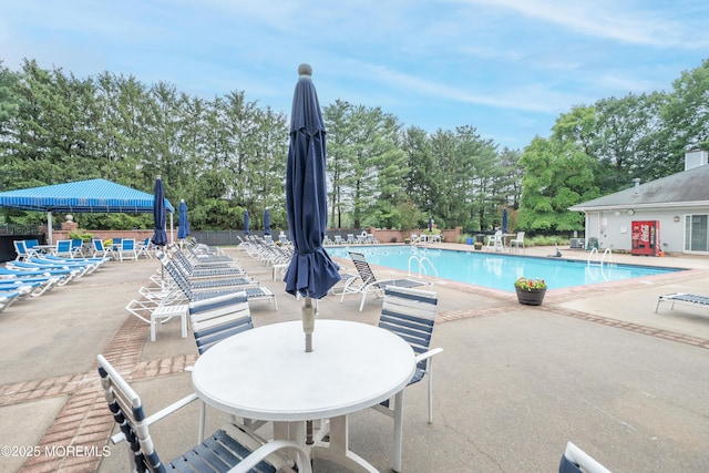 84 Clay St, North Brunswick, NJ 08902 - community pool with a patio area and view of wooded area