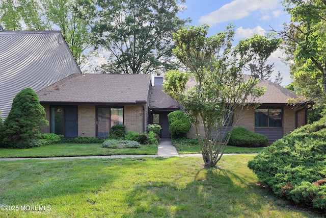 33 Claremont Ct, Red Bank, NJ 07701 - mid-century home featuring brick siding, a front lawn, and roof with shingles