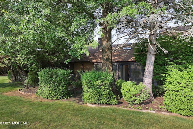 33 Claremont Ct, Red Bank, NJ 07701 - view of side of home featuring a chimney and a yard