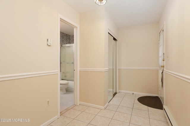 33 Claremont Ct, Red Bank, NJ 07701 - full bath with baseboard heating, tile patterned flooring, and shower / bath combination with glass door