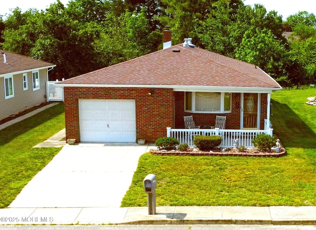 861 Jamaica Blvd, Toms River, NJ 08757 - view of front of house with covered porch, driveway, brick siding, and a front lawn