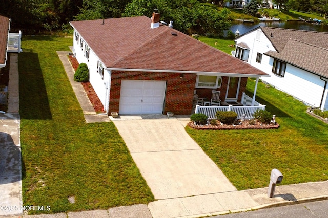 861 Jamaica Blvd, Toms River, NJ 08757 - view of front facade with covered porch, an attached garage, brick siding, and a water view