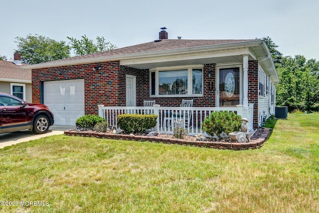 861 Jamaica Blvd, Toms River, NJ 08757 - view of front of house featuring a garage, brick siding, a chimney, a porch, and a front yard