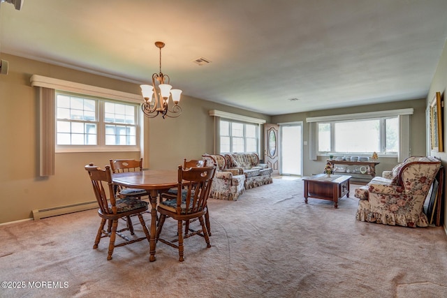 861 Jamaica Blvd, Toms River, NJ 08757 - dining space with healthy amount of natural light, a chandelier, a baseboard radiator, and carpet flooring