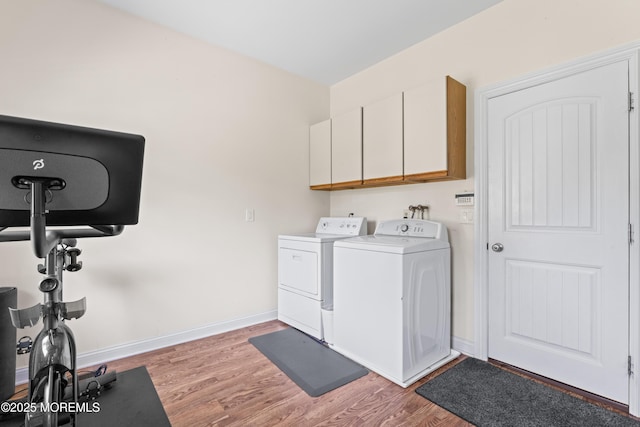 1523 Marconi Rd, Wall, NJ 07719 - washroom with separate washer and dryer, cabinet space, and light wood-style floors