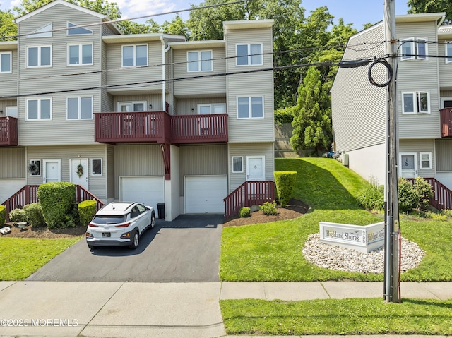 255 Shore Dr Unit 8, Highlands, NJ 07732 - multi unit property featuring an attached garage, driveway, a balcony, and a front lawn