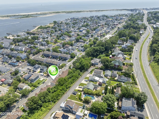 255 Shore Dr Unit 8, Highlands, NJ 07732 - aerial view of property and surrounding area with a large body of water and nearby suburban area