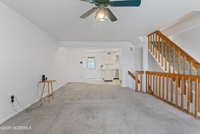 255 Shore Dr Unit 8, Highlands, NJ 07732 - unfurnished living room with ceiling fan, carpet, stairway, and a textured ceiling