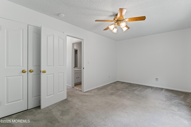 255 Shore Dr Unit 8, Highlands, NJ 07732 - unfurnished bedroom with carpet, a closet, a ceiling fan, and a textured ceiling