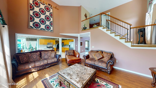 5 Samantha Dr, Monroe, NJ 08831 - living area with wood finished floors, a towering ceiling, and stairway