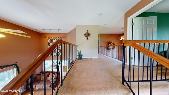 5 Samantha Dr, Monroe, NJ 08831 - hall featuring rail lighting, carpet floors, and an upstairs landing