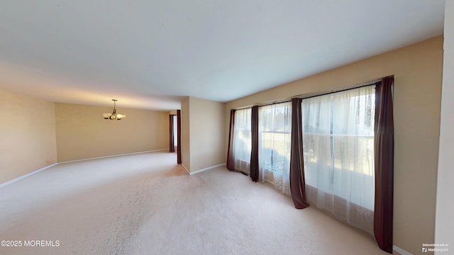 5 Samantha Dr, Monroe, NJ 08831 - spare room with a chandelier and light colored carpet