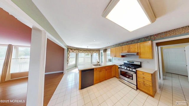 5 Samantha Dr, Monroe, NJ 08831 - kitchen featuring stainless steel gas range oven, dishwasher, light countertops, a peninsula, and under cabinet range hood