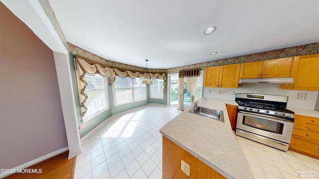 5 Samantha Dr, Monroe, NJ 08831 - kitchen with stainless steel gas range, under cabinet range hood, light countertops, light tile patterned floors, and recessed lighting