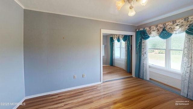 5 Samantha Dr, Monroe, NJ 08831 - empty room featuring light wood-style flooring and crown molding